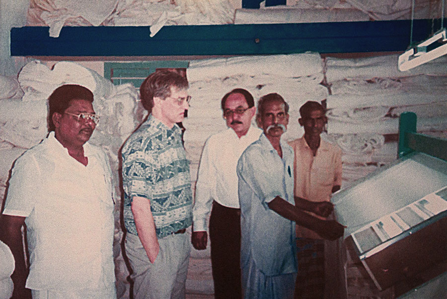 J.C. Schott inspecting fabric, southern India, circa 1993